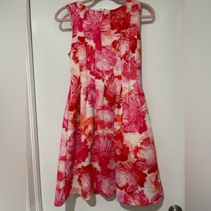 Beautiful dress with pockets in several shades of pinks, oranges, reds . Lined.